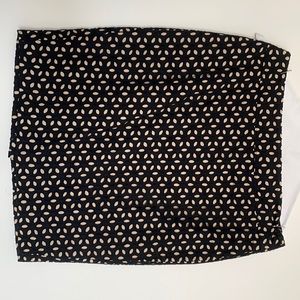 Work skirt, black flowers over light pink fabric